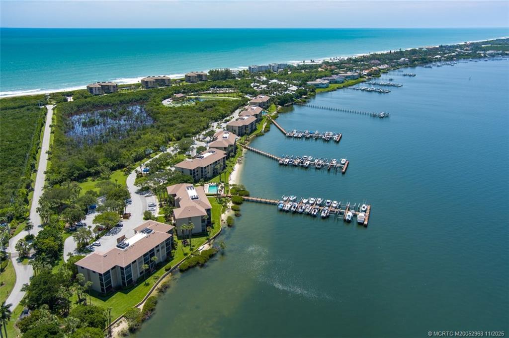 4540 Northeast Sandpebble Trace, Unit 203 Stuart, FL 34996 - Photo 1 of 30 an aerial view of a city with ocean view