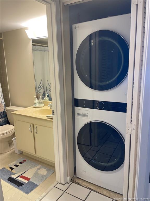 4540 Northeast Sandpebble Trace, Unit 203 Stuart, FL 34996 - Photo 20 of 30 a utility room with sink dryer and washer