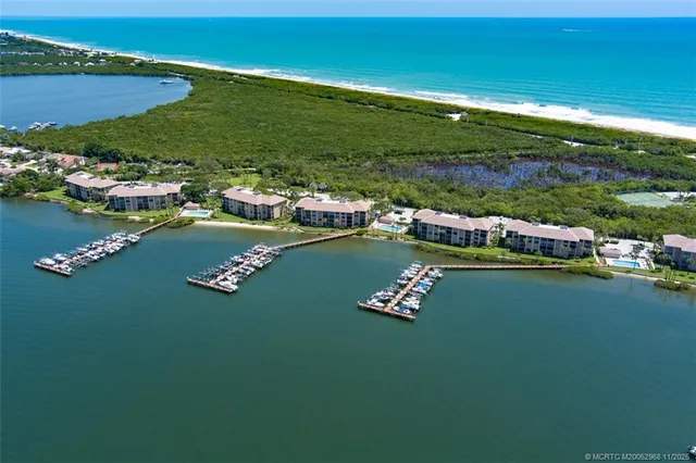 a view of a lake with lawn chairs