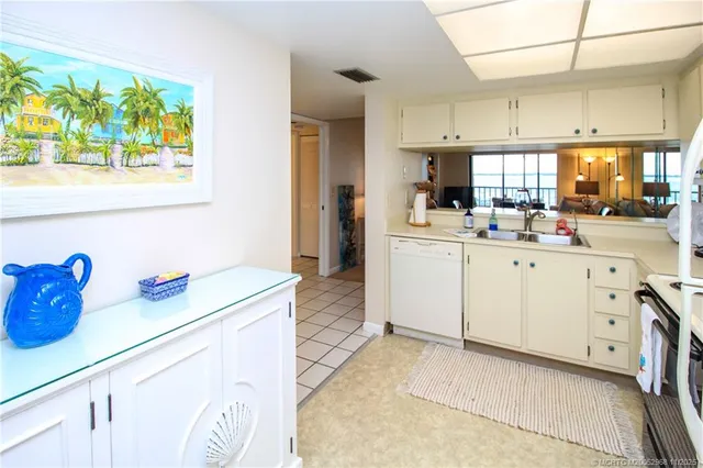a kitchen with cabinets and window