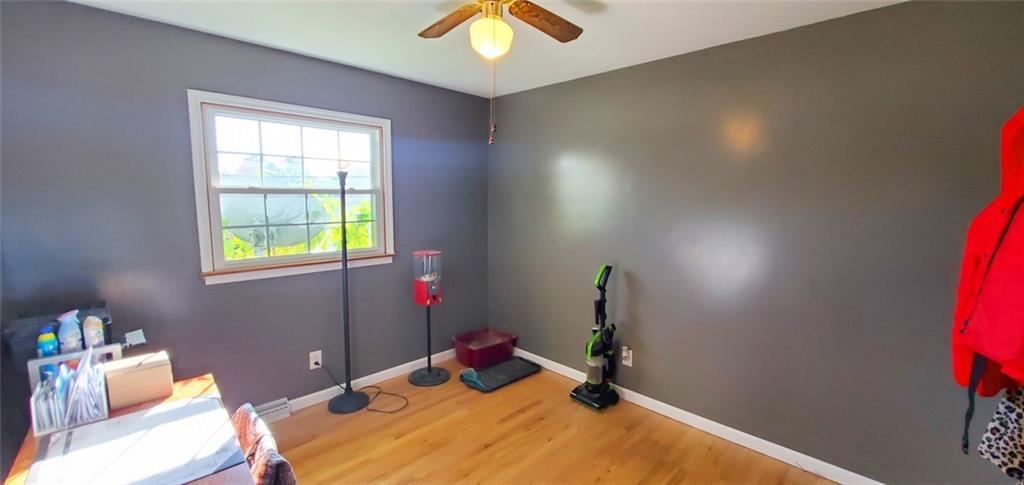 324 West Butler Street Mercer, PA 16137 - Photo 12 of 23 a bedroom with a bed and a chandelier