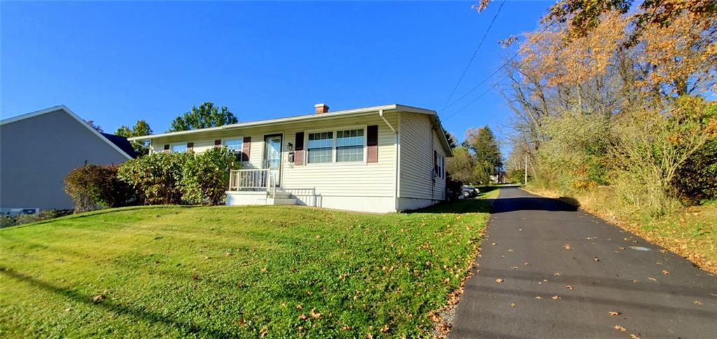 324 West Butler Street Mercer, PA 16137 - Photo 16 of 23 a front view of a house with garden