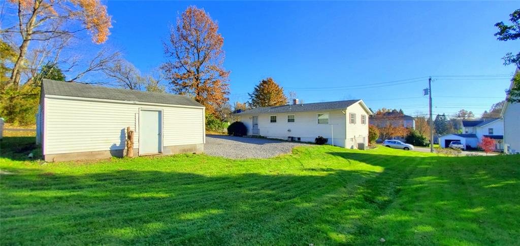 324 West Butler Street Mercer, PA 16137 - Photo 20 of 23 a front view of a house with a yard and garage