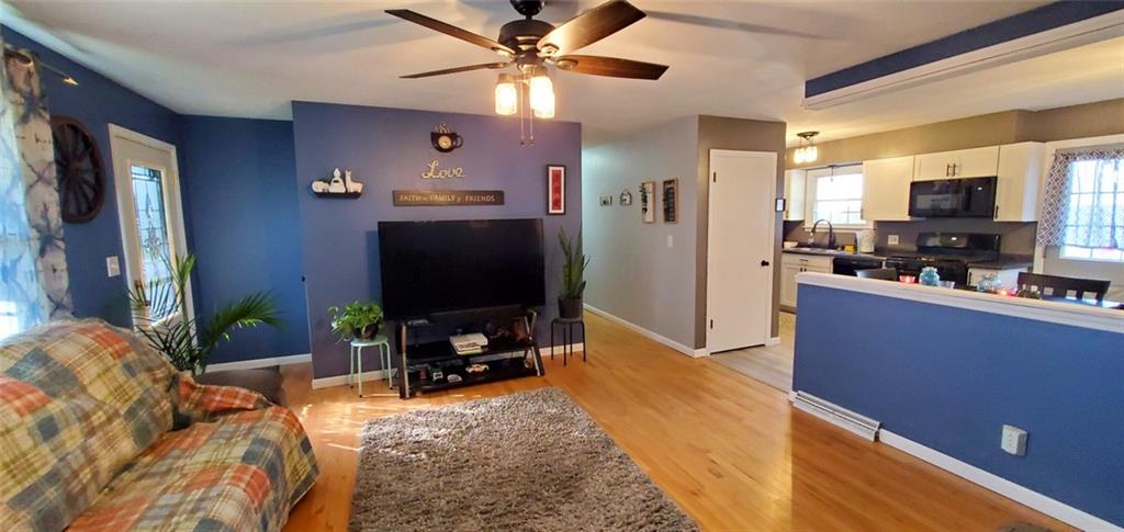 324 West Butler Street Mercer, PA 16137 - Photo 4 of 23 a living room with furniture and a flat screen tv