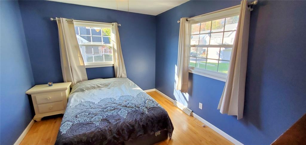 324 West Butler Street Mercer, PA 16137 - Photo 9 of 23 a bedroom with a bed and wooden floor