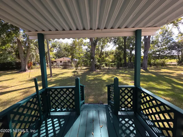 a view of swimming pool with a yard