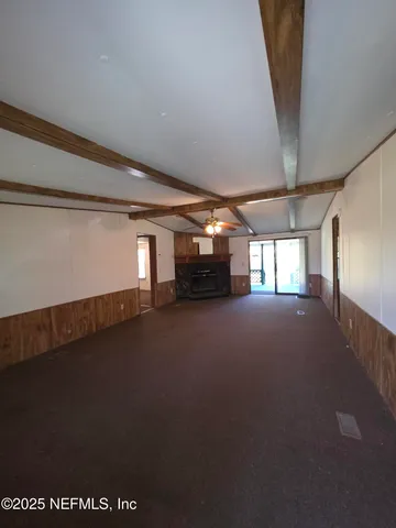 a kitchen with a refrigerator and a stove top oven