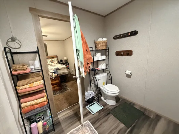 a white toilet sitting next to a bathroom sink