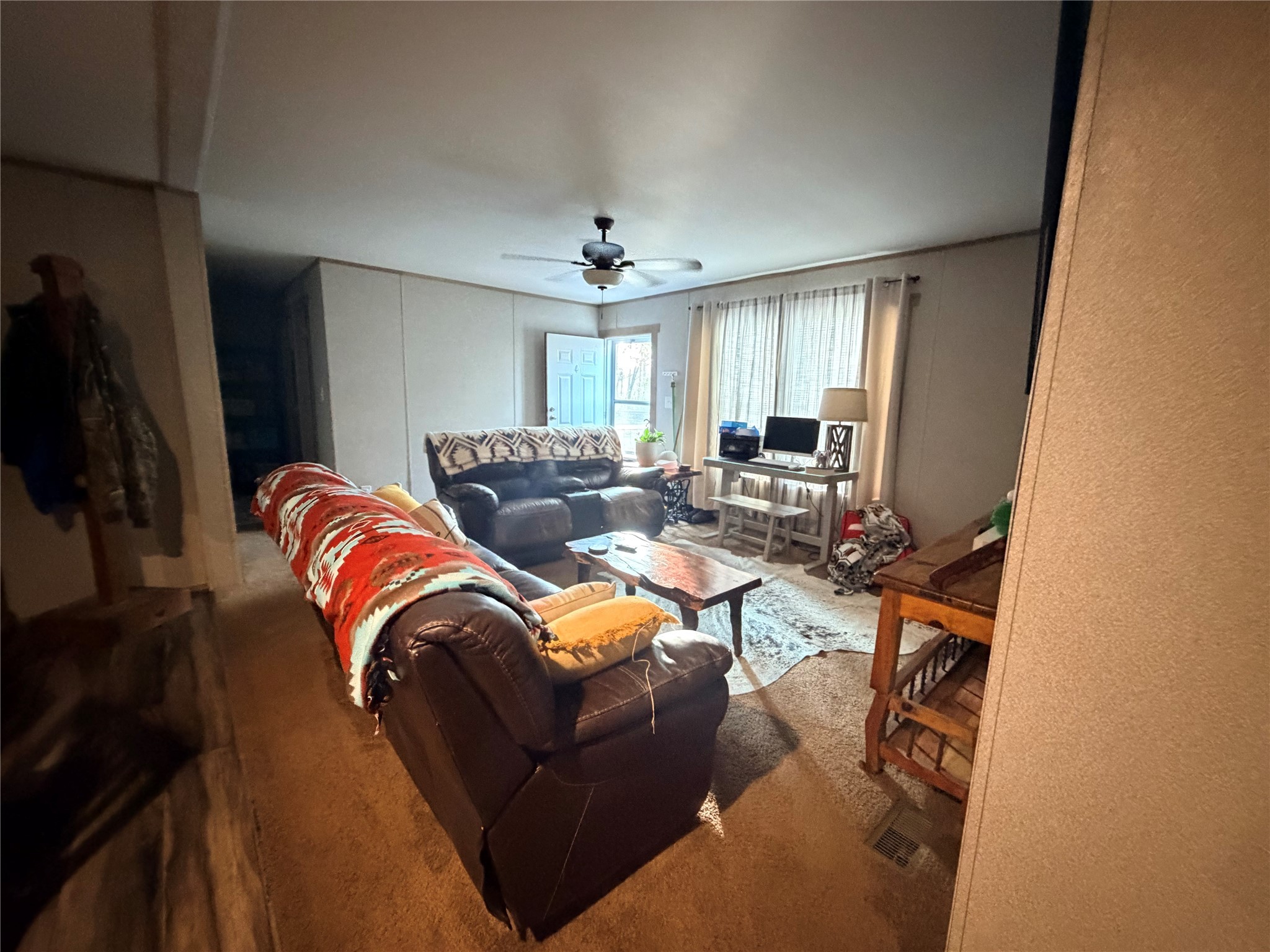 95 Westlake Road Trinity, TX 75862 - Photo 5 of 16 a living room with furniture a flat screen tv and large window