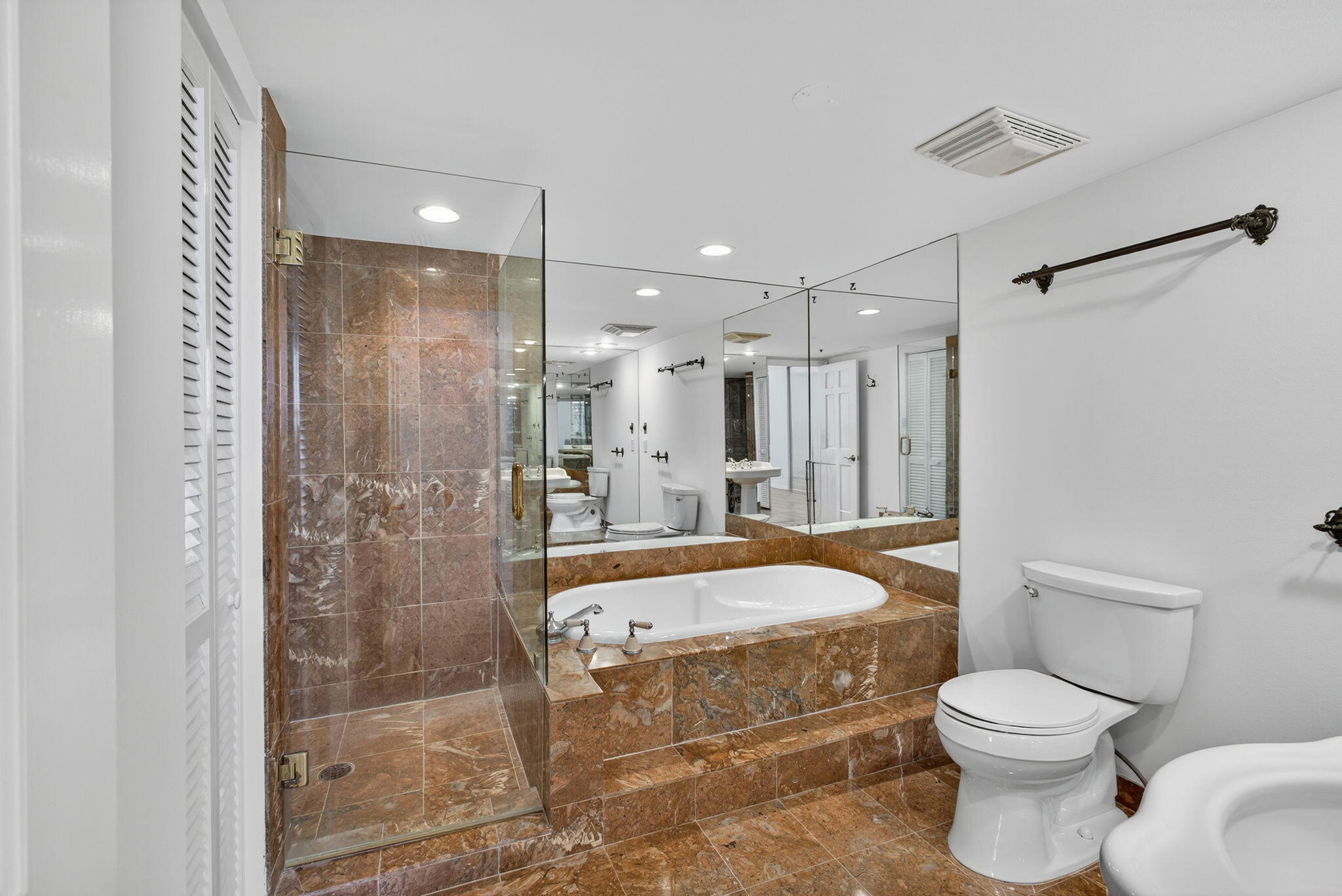 5280 North Ocean Drive, Unit 14D Riviera Beach, FL 33404 - Photo 16 of 55 a bathroom with a sink toilet and shower