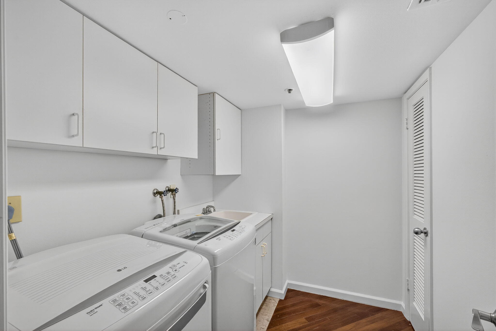 5280 North Ocean Drive, Unit 14D Riviera Beach, FL 33404 - Photo 19 of 55 a view of storage and utility room with washer and dryer