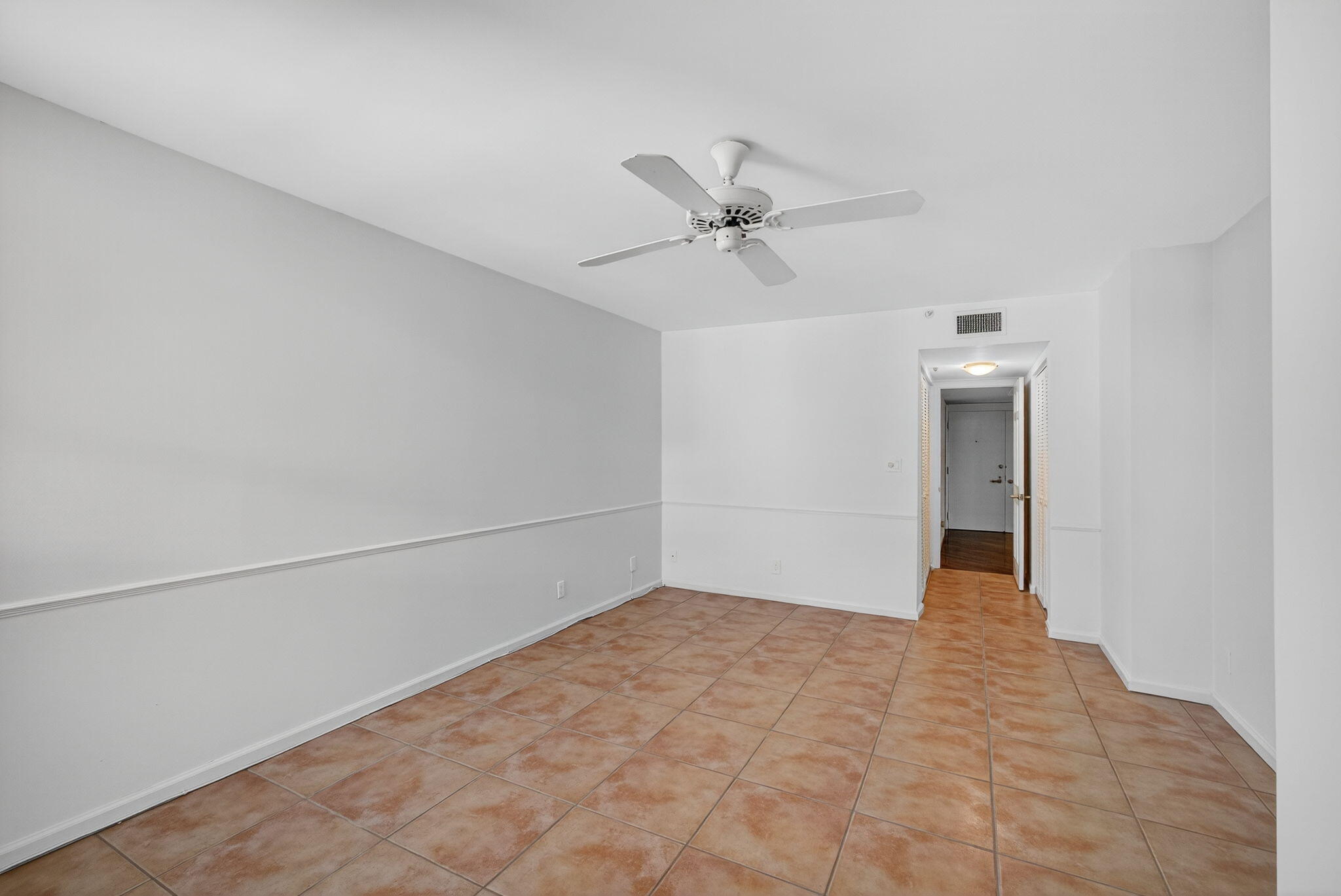 5280 North Ocean Drive, Unit 14D Riviera Beach, FL 33404 - Photo 22 of 55 a view of empty room with a ceiling fan