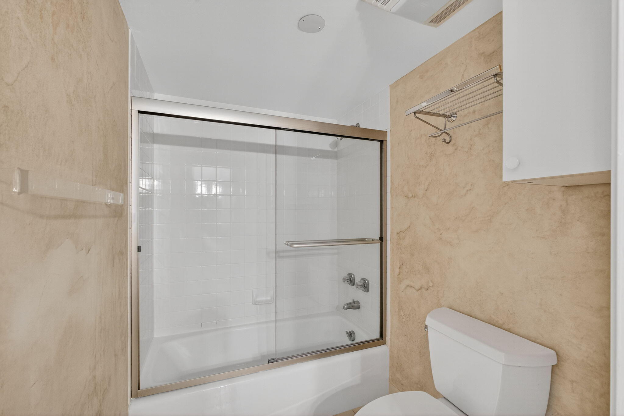 5280 North Ocean Drive, Unit 14D Riviera Beach, FL 33404 - Photo 24 of 55 a bathroom with a shower and a toilet