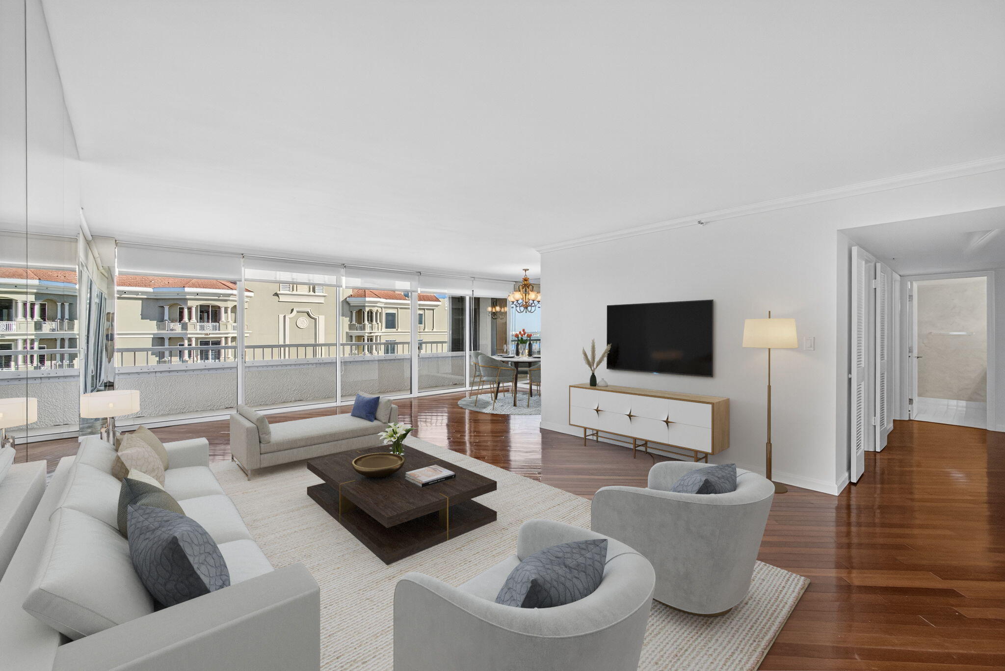 5280 North Ocean Drive, Unit 14D Riviera Beach, FL 33404 - Photo 5 of 55 a living room with furniture and a flat screen tv