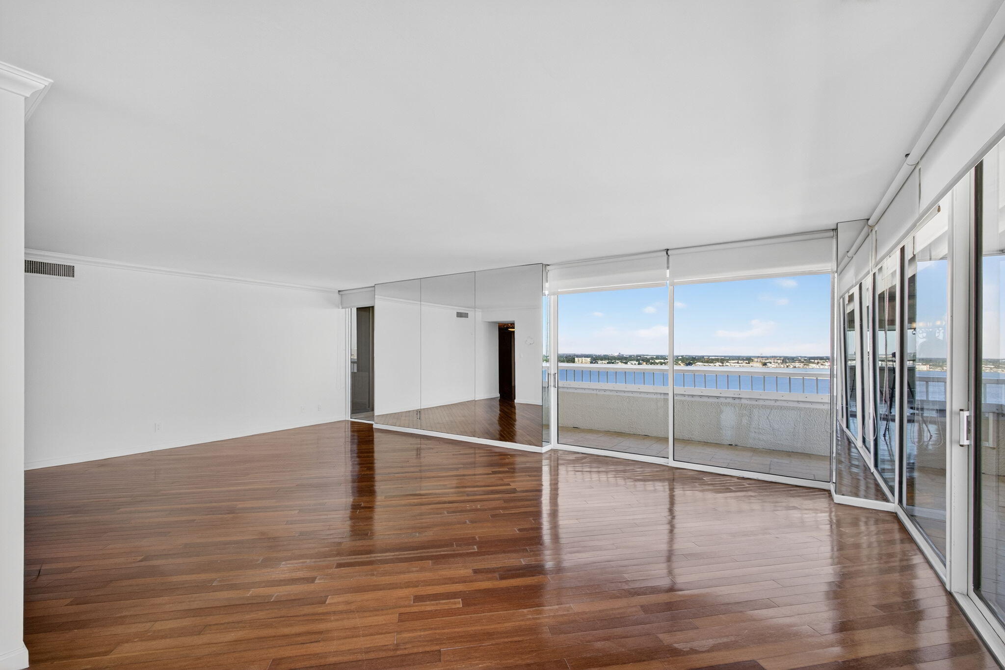 5280 North Ocean Drive, Unit 14D Riviera Beach, FL 33404 - Photo 8 of 55 a view of empty room with wooden floor