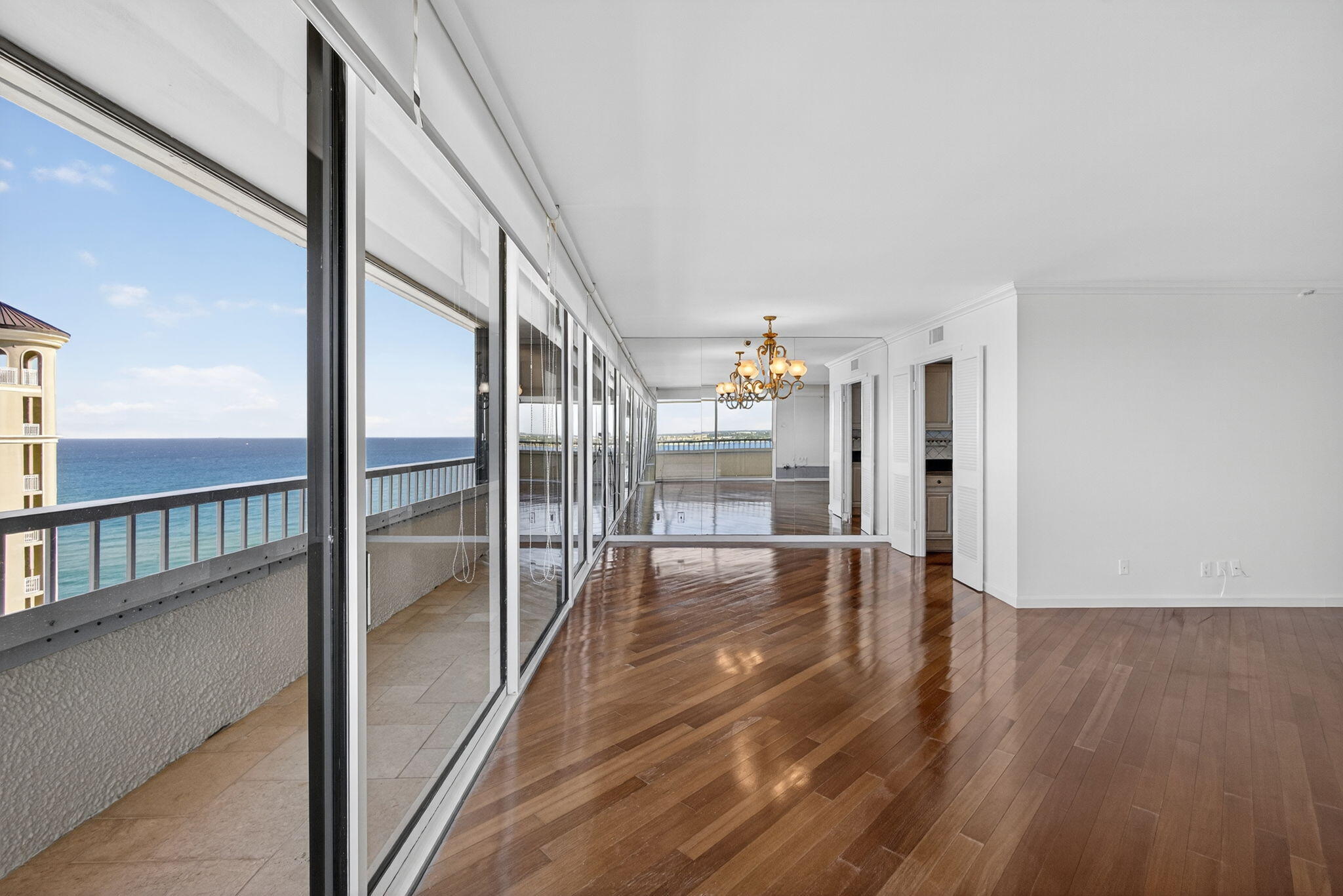 5280 North Ocean Drive, Unit 14D Riviera Beach, FL 33404 - Photo 10 of 55 a view of interior space with wooden floor and windows