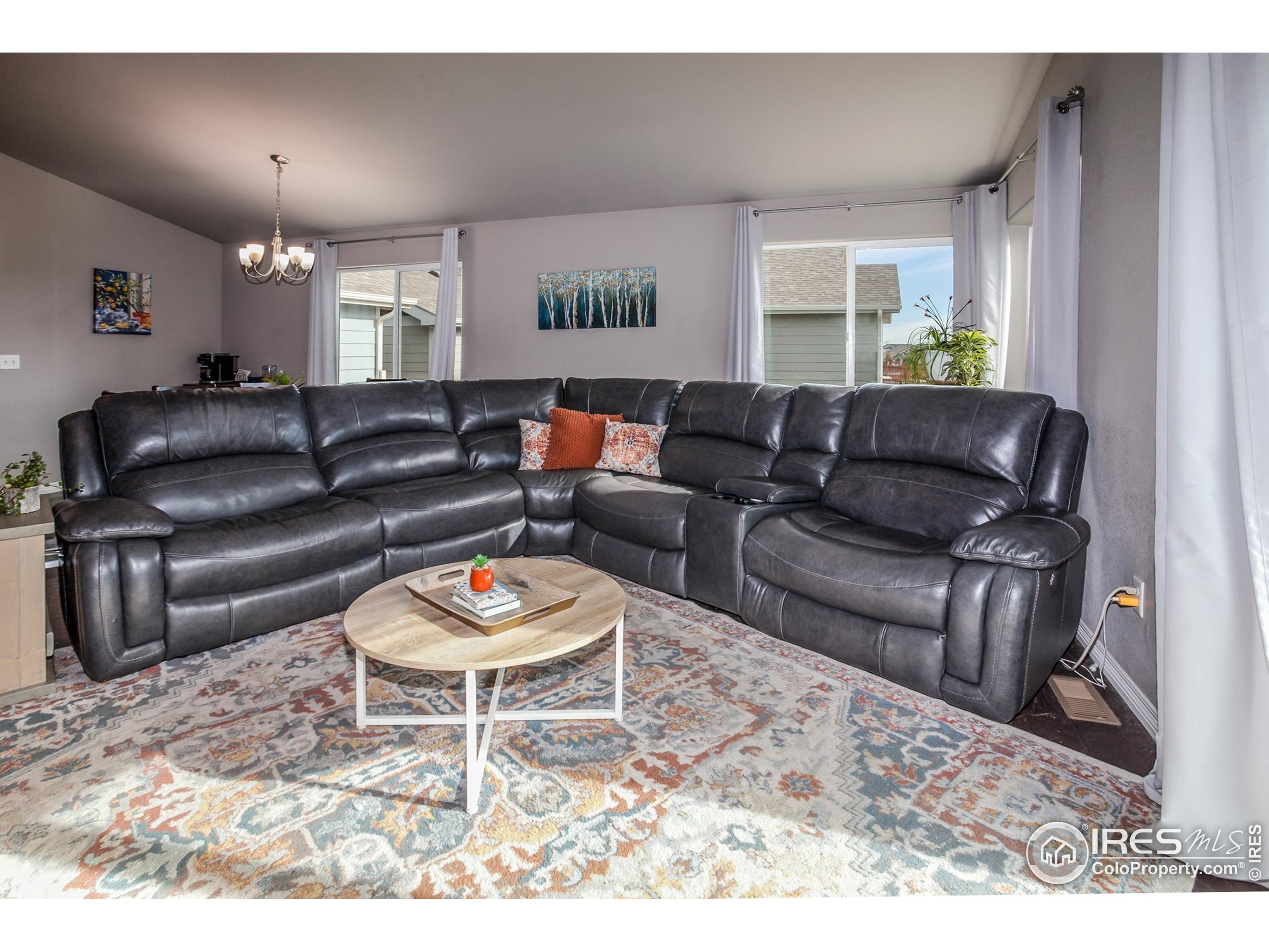 1297 Wild Basin Road Severance, CO 80550 - Photo 13 of 44 a living room with furniture and a rug