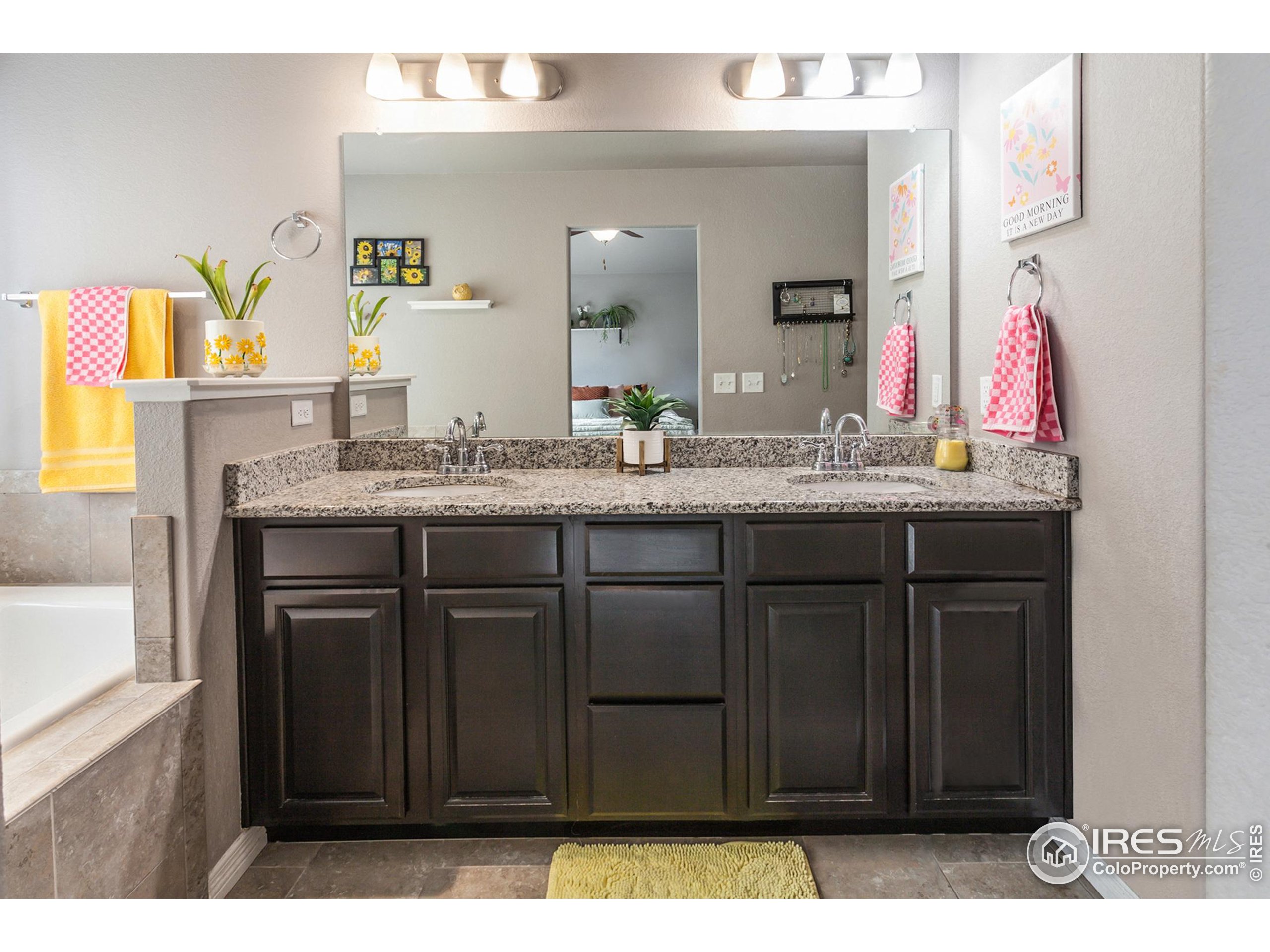 1297 Wild Basin Road Severance, CO 80550 - Photo 22 of 44 a bathroom with a sink and a mirror