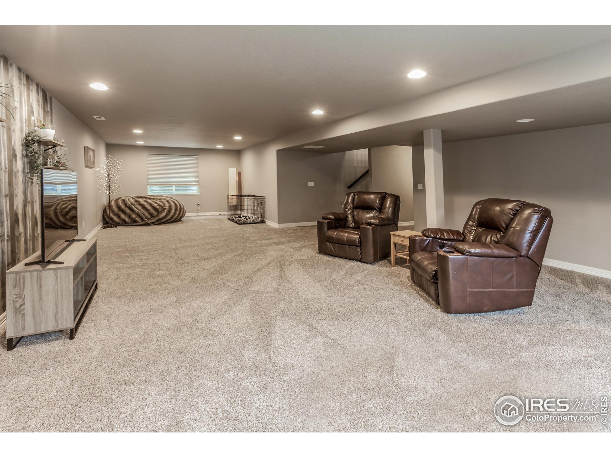 1297 Wild Basin Road Severance, CO 80550 - Photo 29 of 44 a large room with lots of chairs and a projector