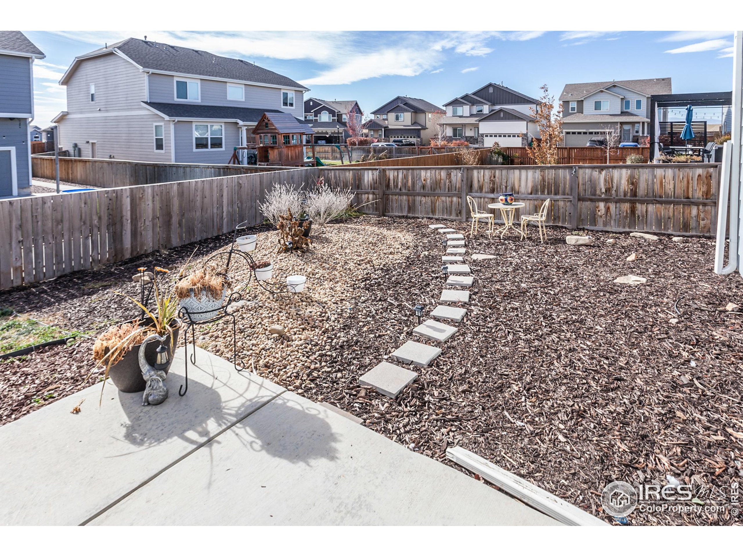 1297 Wild Basin Road Severance, CO 80550 - Photo 38 of 44 a view of a terrace with a bench