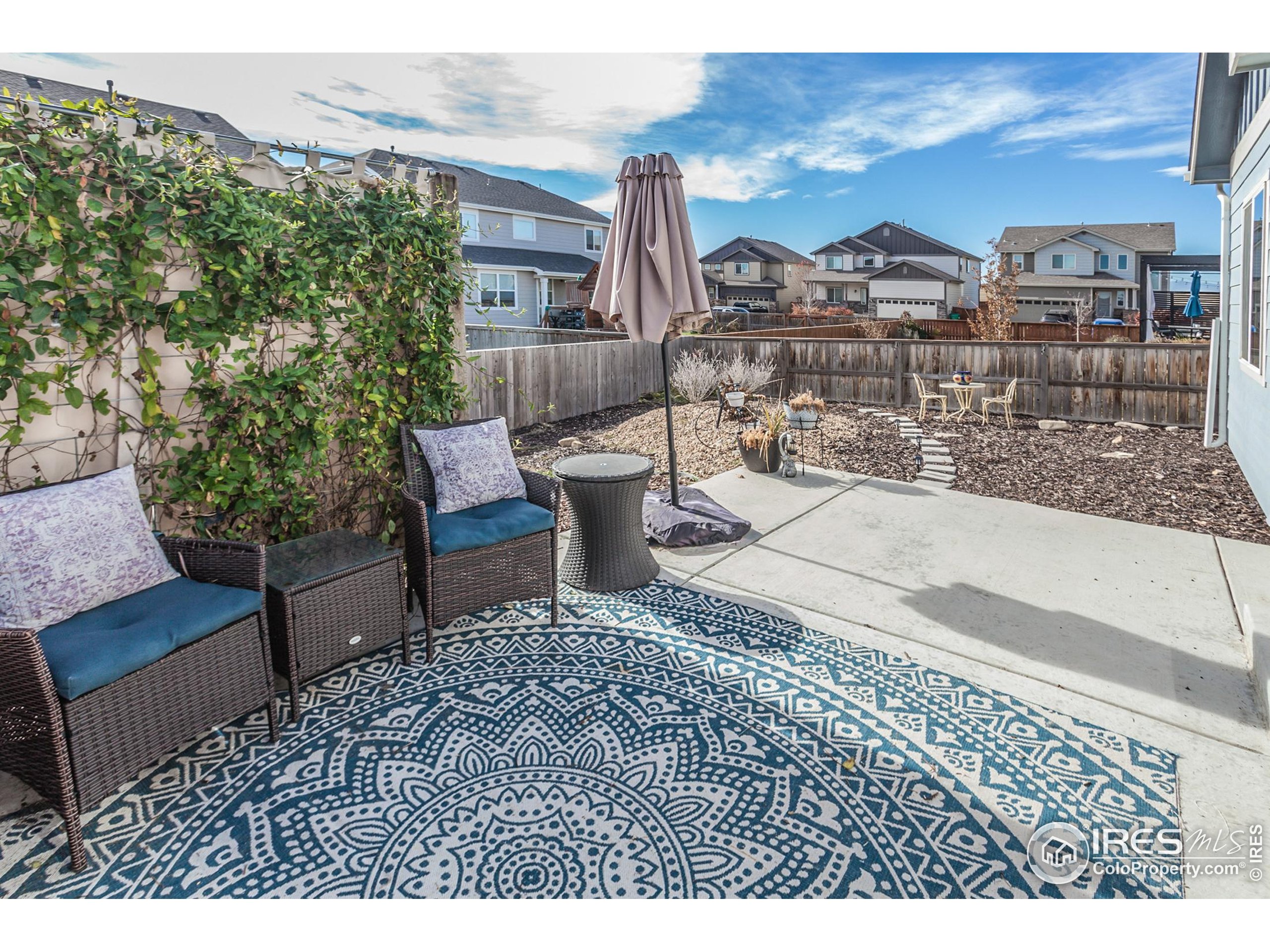 1297 Wild Basin Road Severance, CO 80550 - Photo 42 of 44 a view of a terrace with furniture and city view