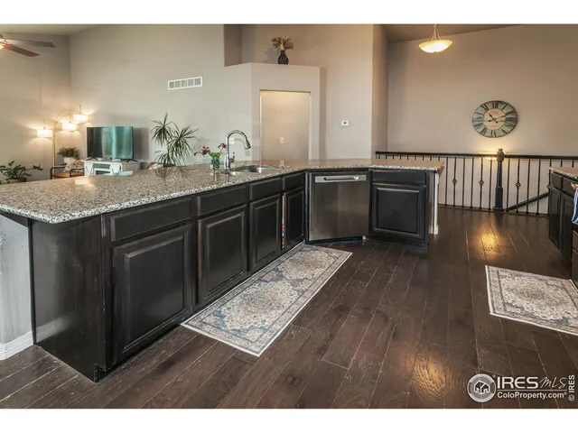a kitchen with a sink and a stove top oven