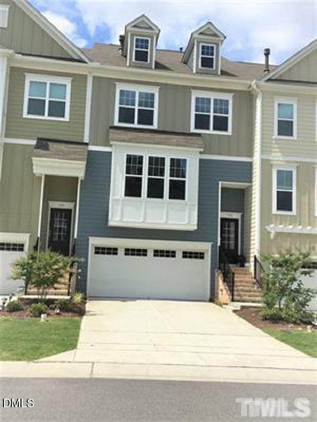 725 Edgewater Ridge Court Apex, NC 27523 - Photo 2 of 22 a front view of a house with a yard