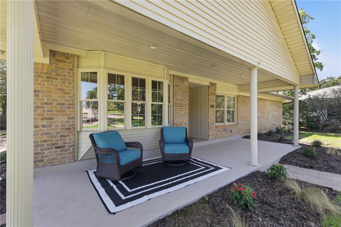 515 Crescent Drive Bryan, TX 77801 - Photo 3 of 43 Covered front porch featuring a brick exterior and siding accents