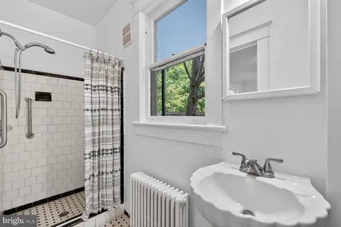 a bathroom with a sink and a shower