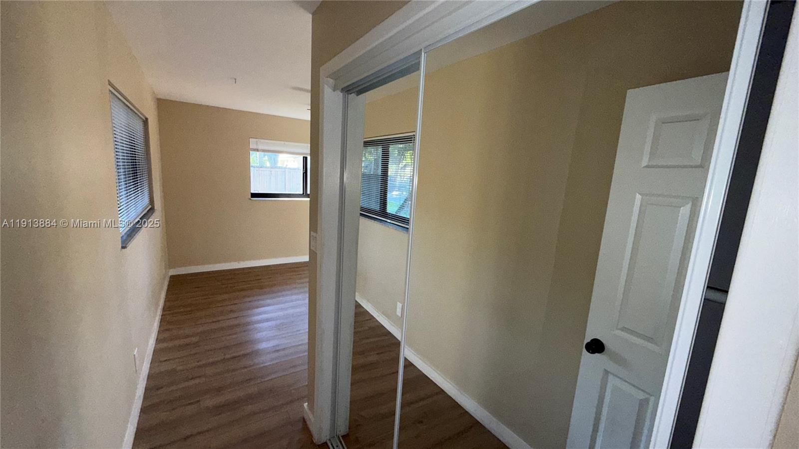 6625 Southwest 49th Street, Unit 2W Davie, FL 33314 - Photo 11 of 33 a view of a hallway with wooden floor and staircase