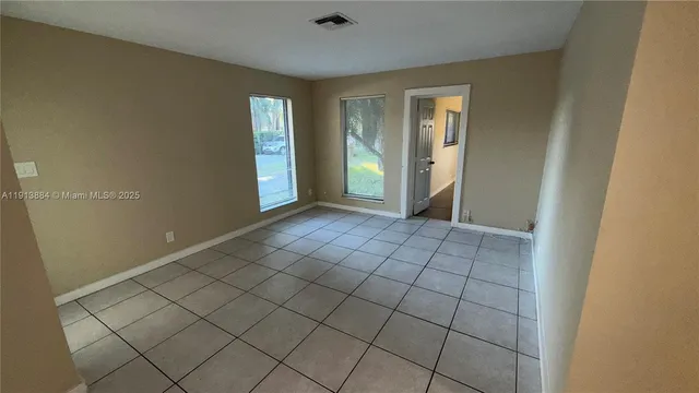 a view of an empty room and window