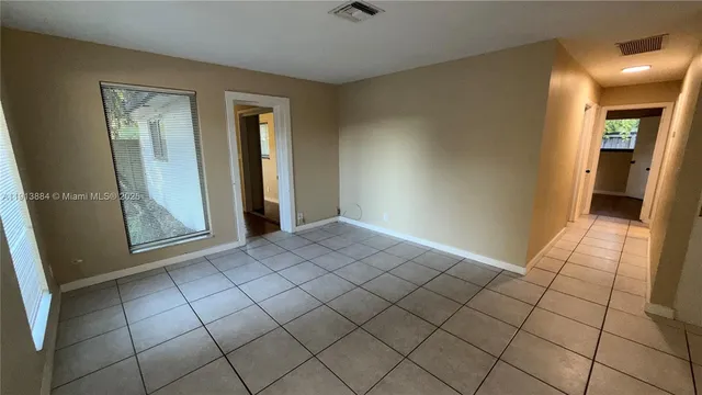 a view of an empty room and window