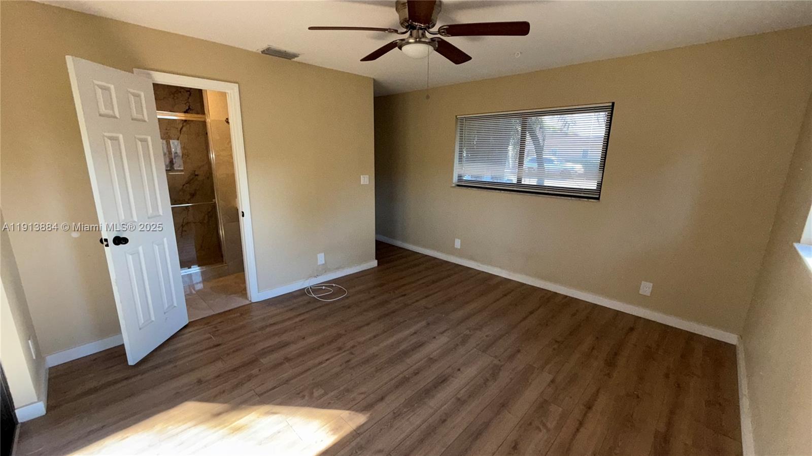 6625 Southwest 49th Street, Unit 2W Davie, FL 33314 - Photo 25 of 33 a view of a hallway with wooden floor and closet area