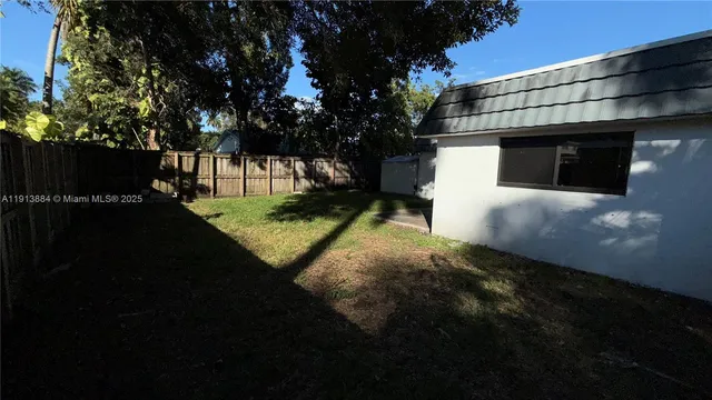 a view of a room with wooden walls