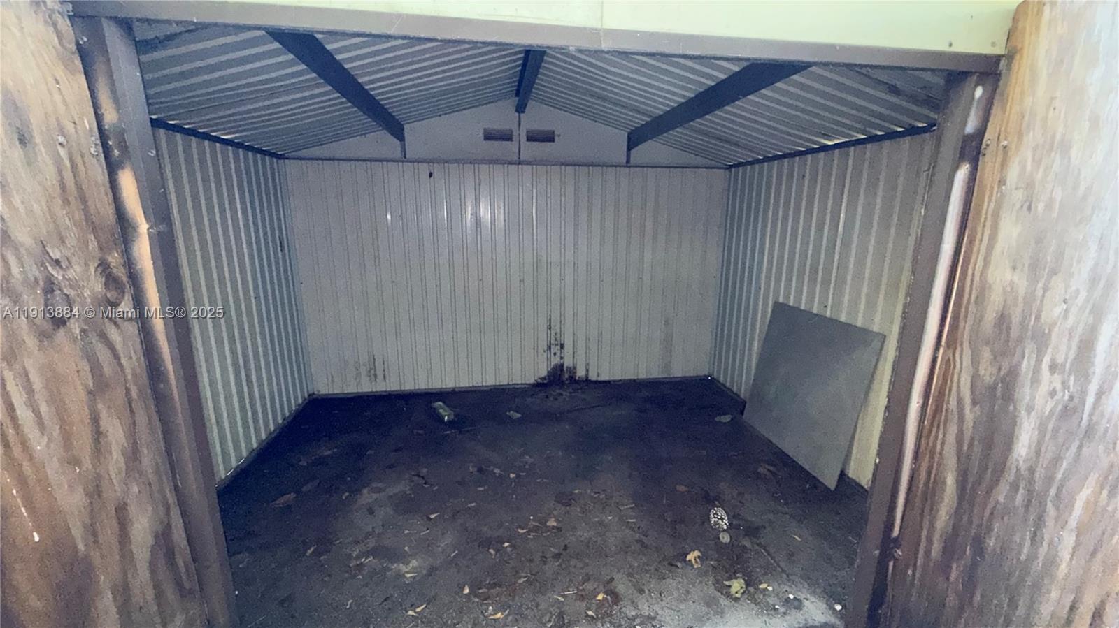 6625 Southwest 49th Street, Unit 2W Davie, FL 33314 - Photo 33 of 33 a view of a room with wooden walls