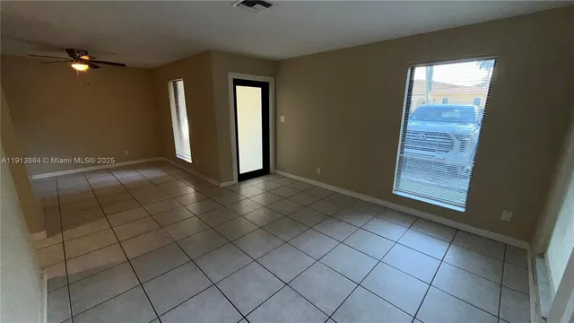 a view of an empty room and window