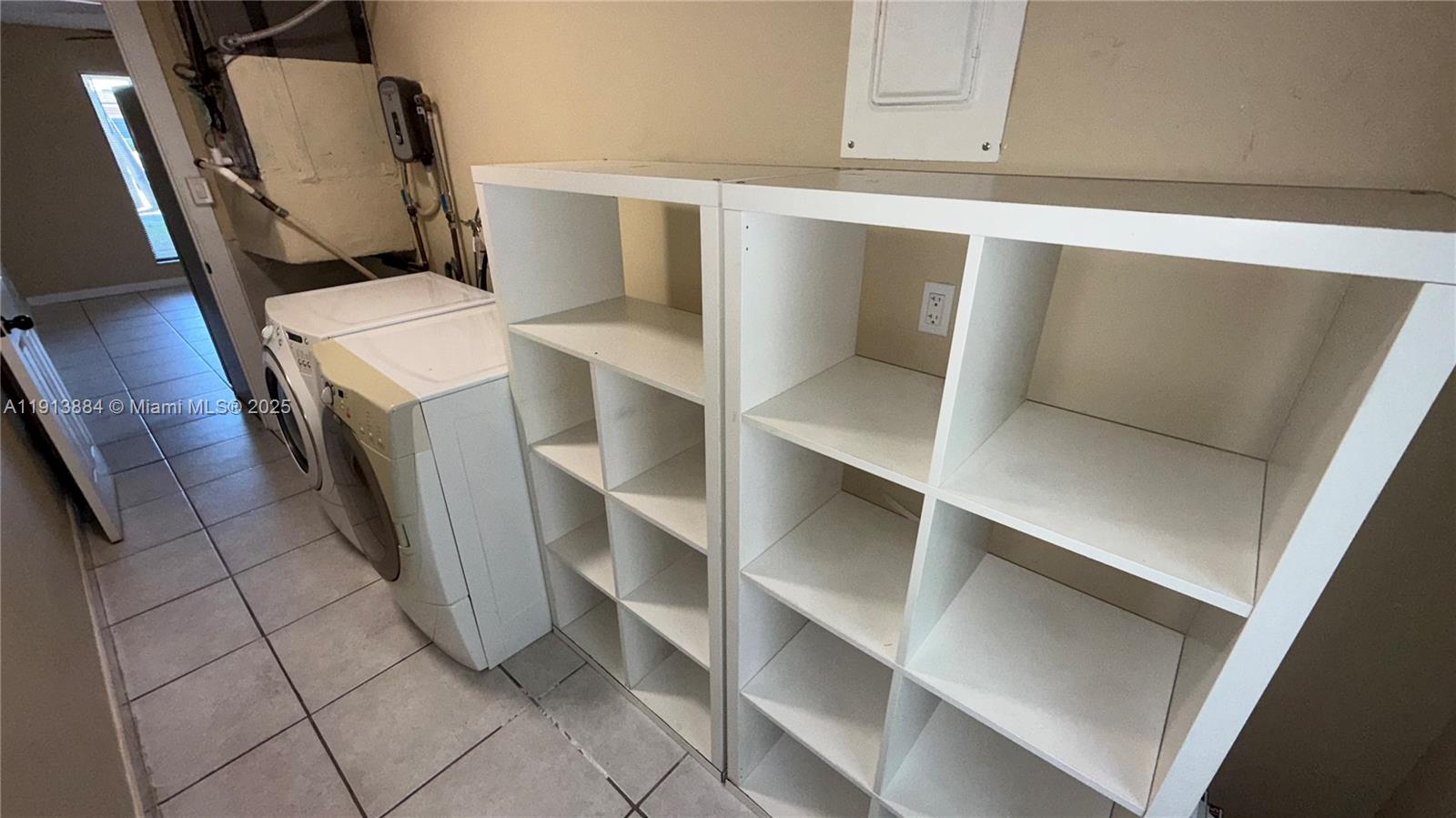 6625 Southwest 49th Street, Unit 2W Davie, FL 33314 - Photo 9 of 33 a view of walk in closet with clothes and shoes