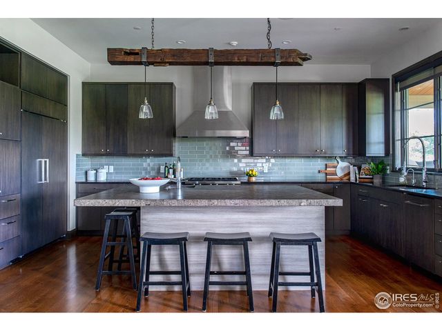 a kitchen with a table and chairs in it