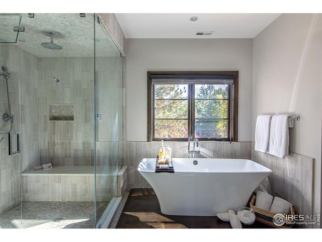 a bathroom with a sink a mirror and a bathtub