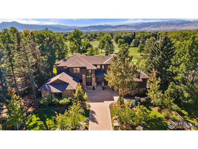 a view of a garden with an outdoor seating