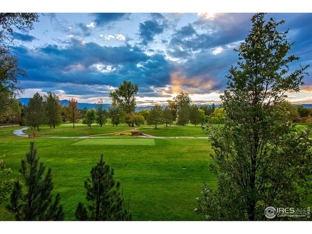 a view of a golf course with a lake
