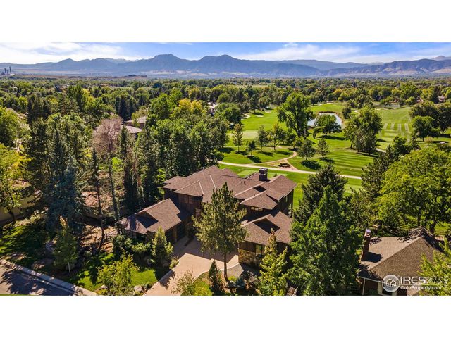 a view of a city with mountains in the background