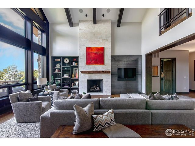 a living room with furniture window and a fireplace