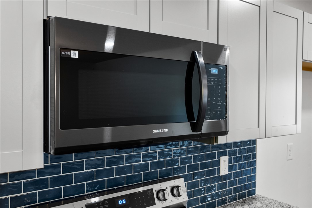 1215 East Whitner Street Anderson, SC 29624 - Photo 13 of 30 Enjoy the modern convenience of a built-in microwave, seamlessly integrated above a sleek range.