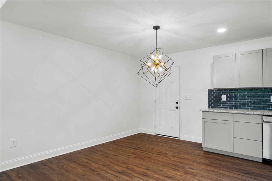 1215 East Whitner Street Anderson, SC 29624 - Photo 18 of 30 This bright interior space offers versatile living with seamless integration to the kitchen.