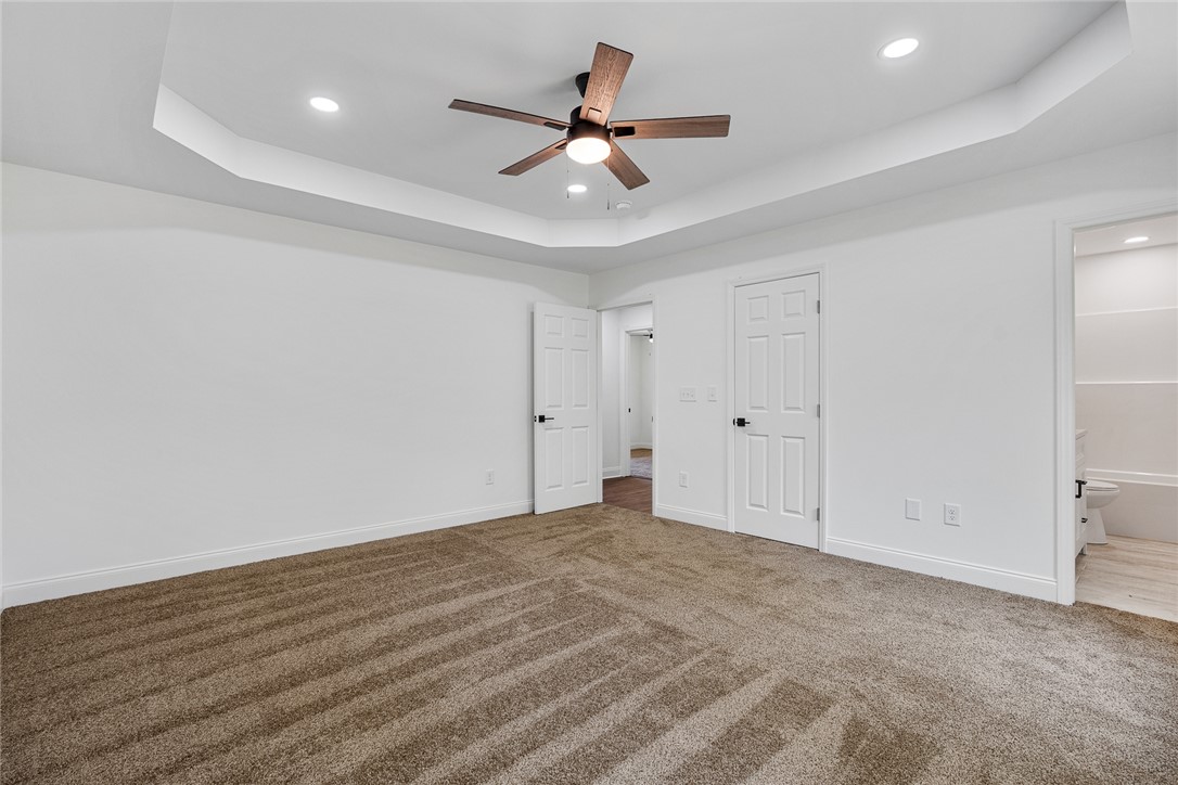 1215 East Whitner Street Anderson, SC 29624 - Photo 20 of 30 An inviting room features plush carpeting and elegant recessed lighting.