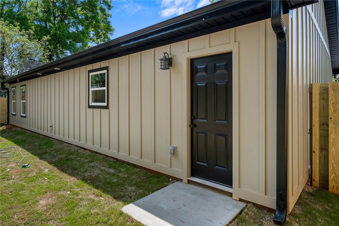 1215 East Whitner Street Anderson, SC 29624 - Photo 27 of 30 This newly constructed exterior boasts modern siding, clean lines, and an inviting side entry.