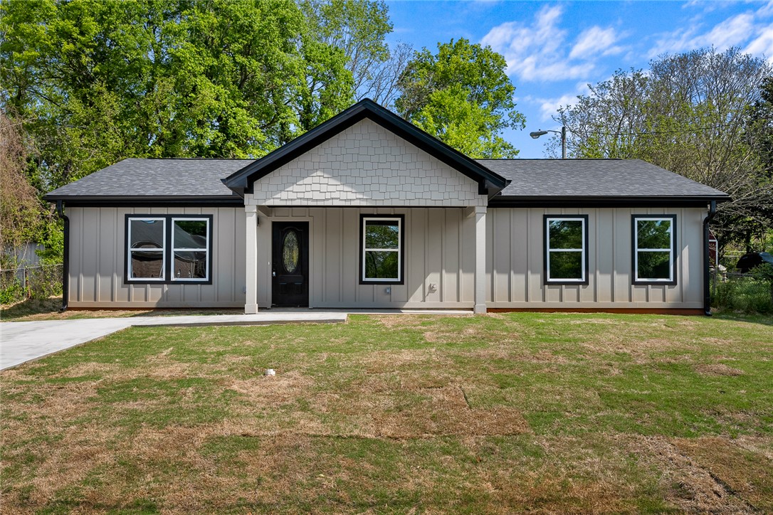 1215 East Whitner Street Anderson, SC 29624 - Photo 4 of 30 This newly constructed home presents a contemporary facade with a welcoming entrance.