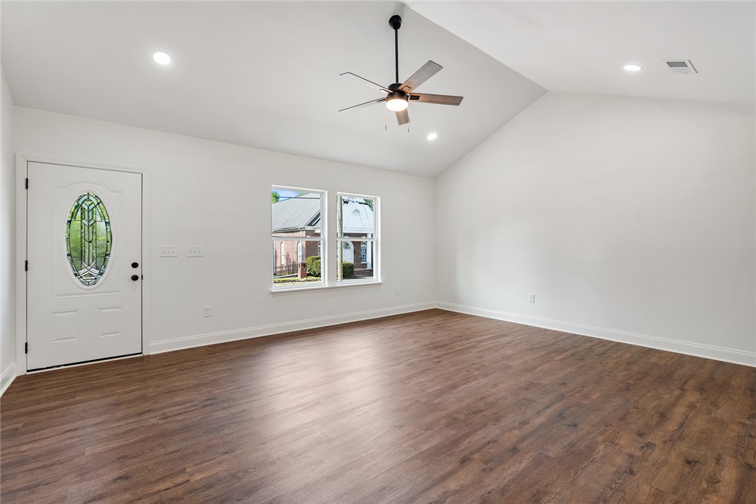 1215 East Whitner Street Anderson, SC 29624 - Photo 8 of 30 Bright and airy living area with high ceilings and rich wood flooring welcomes you home.
