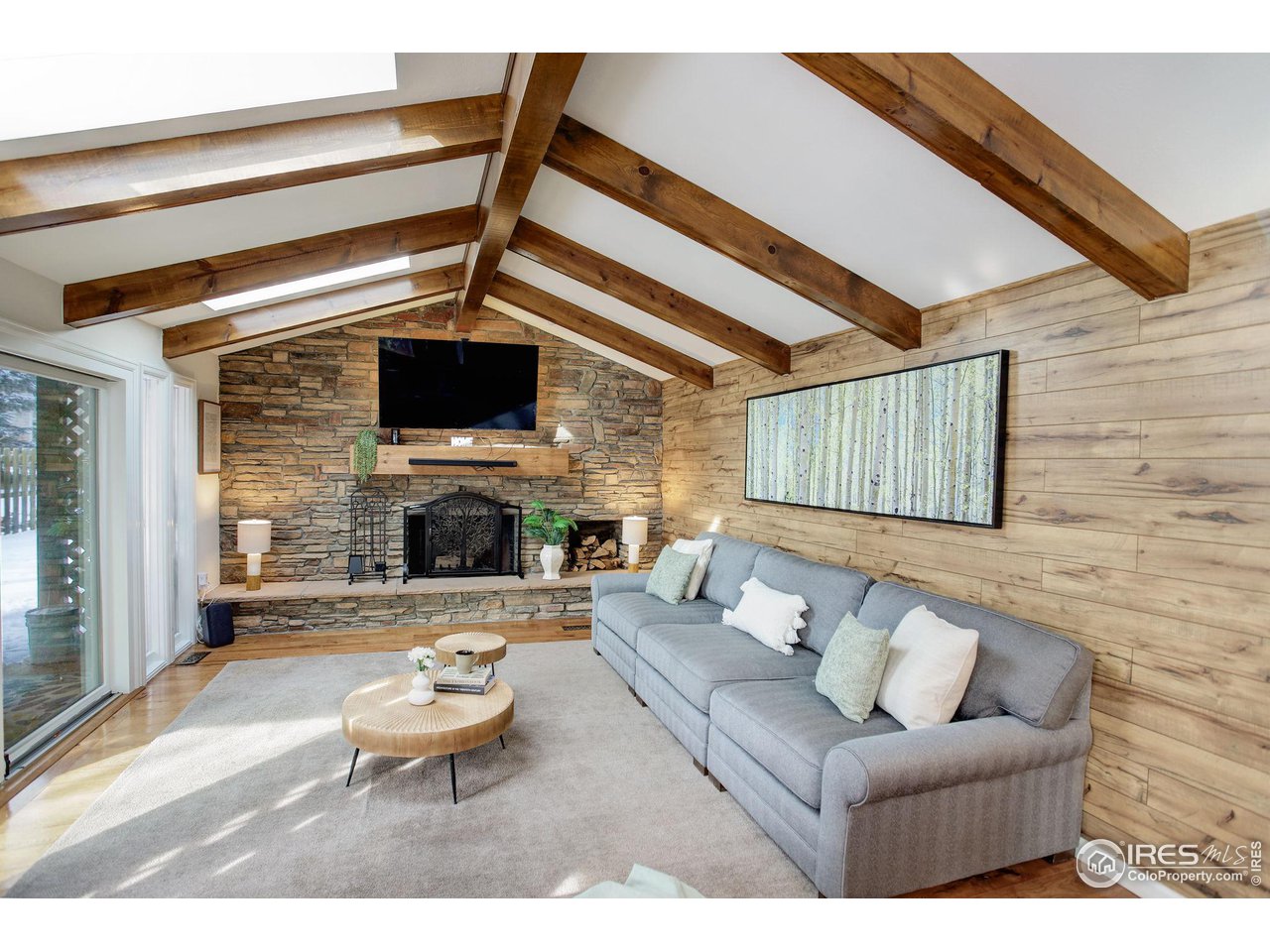 a living room with furniture and a fireplace